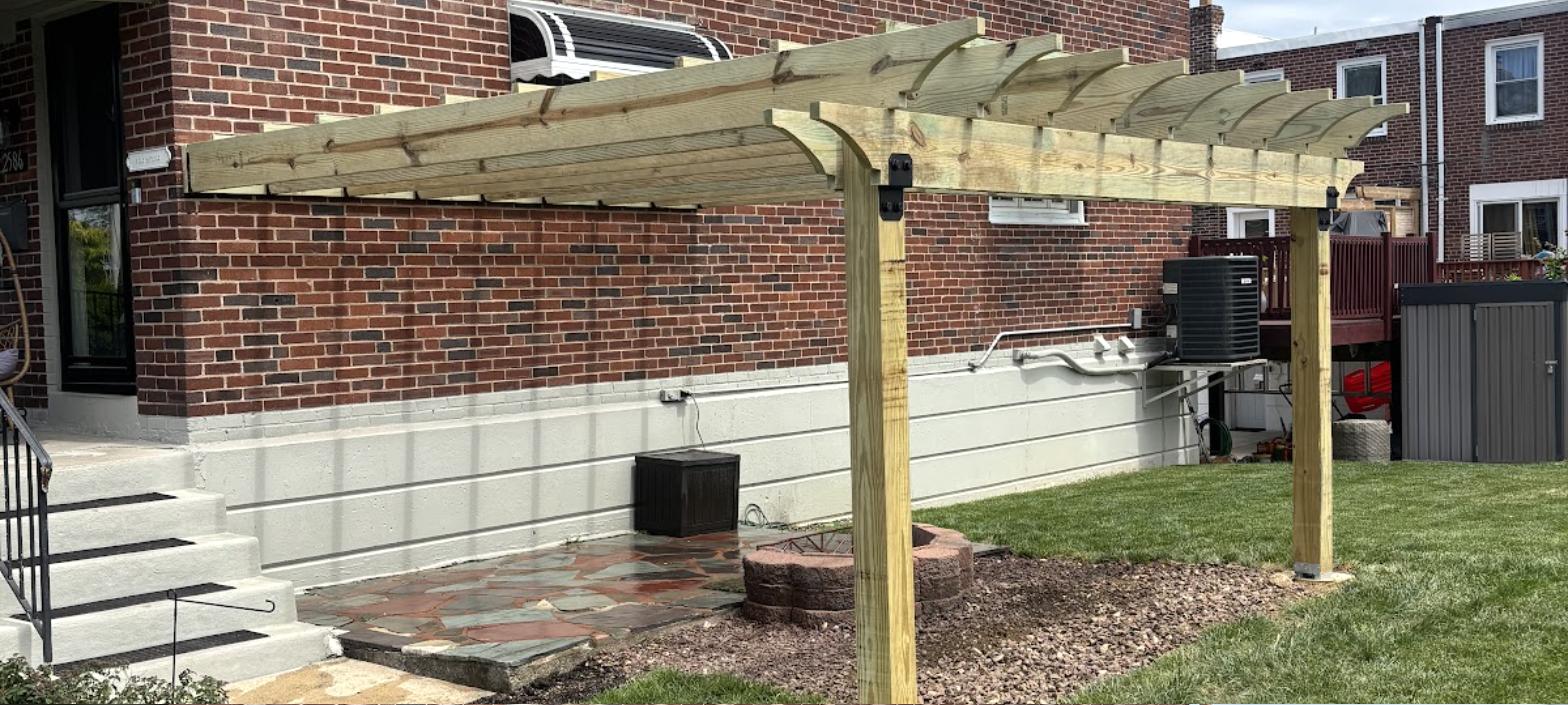 Custom deck build with new pergola framing under construction by RC Deck Co
